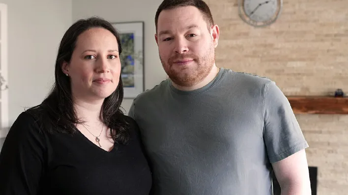 Couple embracing, representing support and hope